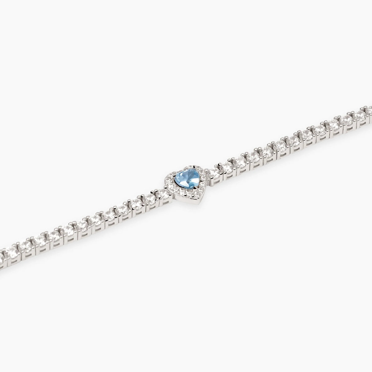 Bracciale tennis in argento 925/°°° rodiato con acquamarina sintetica centrale 4x4 mm taglio cuore e zirconi Ø 2 e 1 mm, lunghezza 16 cm